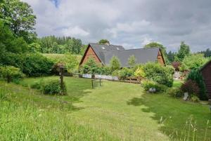 a house with a garden in the middle of a yard at Chalupa Dolní Hedeč blízko Dolní Moravy in Horní Orlice