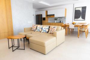 a living room with a couch and a table at Manse 만세 Villa in Ciburial +8 photos