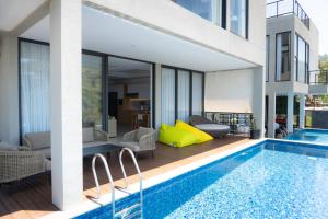 an image of a house with a swimming pool at Manse 만세 Villa in Ciburial