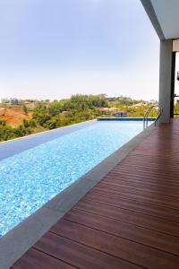 a swimming pool on a deck with a view at Manse 만세 Villa in Ciburial