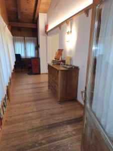 an empty room with a wooden desk in a building at Chalet Luisa in Cima Gogna