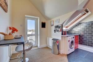 a laundry room with a washer and dryer at 2 Bed in Croyde oc-bolt in Croyde