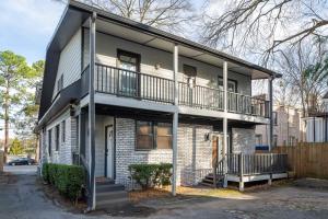an apartment building with a balcony on a street at Boho Lux in Atlanta