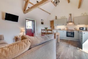 a living room with a couch and a kitchen at 2 Bed in Saltburn-by-the-sea oc-wa021 in Easington