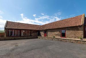 an old stone building with a large parking lot at 2 Bed in Saltburn-by-the-sea oc-wa021 in Easington