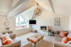 a living room with a couch and a fireplace at 2 Bed in Bamburgh oc-gd1165 in Bamburgh