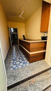 a kitchen with a counter with a laptop on it at Hotel Star Inn , Pushkar in Pushkar
