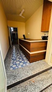 a kitchen with a laptop on top of a counter at Hotel Star Inn , Pushkar in Pushkar