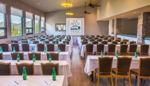 a conference room with tables and chairs with green bottles on them at Holiday Inn Club Vacations - Tahoe Ridge Resort, an IHG Hotel in Stateline