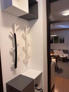 a kitchen with a wall with shelves and a table at Rogla Gaber Studio in Zreče