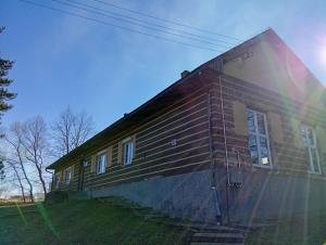 a house with a rainbow on the side of it at Magura Camp in Małastów