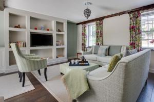 a living room with a couch and chairs and a tv at 3 Bed in Sedbergh oc-ds960 in Milnthorpe