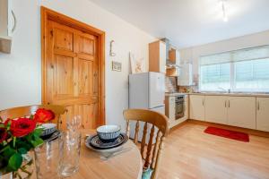 a kitchen and dining room with a table and chairs at 1 Bed in Wadebridge oc-p00232 in Wadebridge +9 photos