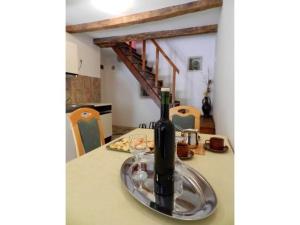 a bottle of wine sitting on top of a table at House Elena in Lindar +5 photos