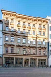 a large building on the corner of a street at Pod Błękitnymi Podkowami in Wrocław
