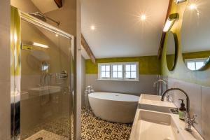 a bathroom with a tub and a sink and a shower at 5 Bed in Padstow oc-p00595 in Padstow +43 photos
