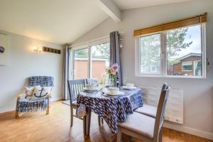 a dining room with a table and chairs and a window at 2 Bed in Padstow oc-p00551 in Saint Merryn