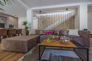 a living room with a couch and a table at Villa Jackie in Bribir