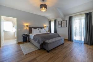 a bedroom with a large bed and a large window at Villa Jackie in Bribir +55 photos