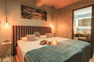 a bedroom with a bed with a book on it at Villa Lorkia in Baška +32 photos