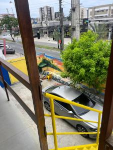 a car parked on the side of a street at Pousada Água Viva in Maceió +2 photos