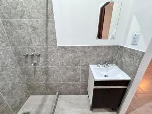 a bathroom with a sink and a shower at Casas Villa azul in Tanti +29 photos