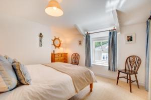 a bedroom with a bed and a window at 2 Bed in Bodmin oc-p00429 in Saint Teath