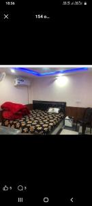 a picture of a room with a bed with puppies at The aditya hotel & Resturdent in Bhukhar