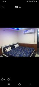 a picture of a bed in a room at The aditya hotel & Resturdent in Bhukhar