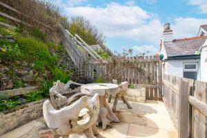 a patio with a table and chairs next to a fence at 2 Bed in Sandsend oc-wa317 in Sandsend +4 photos