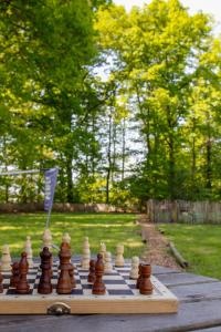 a chess board on a table in a park at Prullenbos Tiny House Nutz Nest in Wetteren