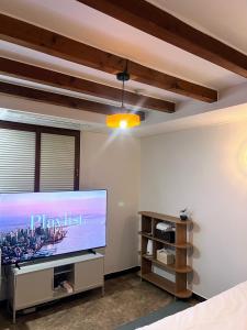 a living room with a large flat screen tv at Stay Us 3151 in Seongnam