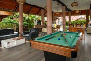 a living room with a pool table in it at West Peninsula Villas in Harrison