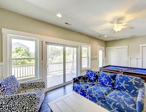 a living room with a couch and a pool table at Little Cayman in Salvo +113 photos