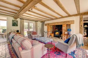 a living room with a couch and a fireplace at 4 Bed in Walpole oc-brof in Walpole