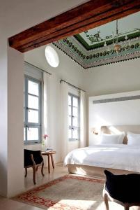 a bedroom with a bed and a coffered ceiling at The Efendi Hotel & Spa - Akko in Acre