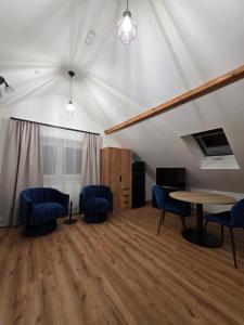 a room with a table and chairs in a tent at Modern apartment in downtown in Schwäbisch Hall