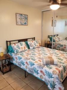 a bedroom with a bed and a mirror at Beach vibes condo in Luquillo in Luquillo