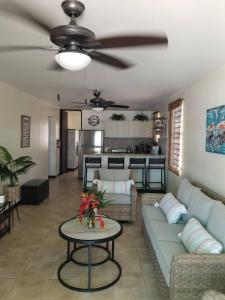 a living room with a couch and a table at Beach vibes condo in Luquillo in Luquillo