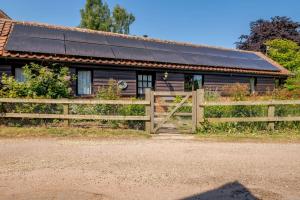 a house with solar panels on the roof at 1 Bed in Saxmundham oc-c27420 in Farnham