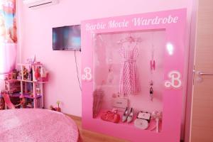 a pink room with a pink home made wardrobe at Barbie-Themed 3BDR Penthouse Near The Beach, Nessebar in Nesebar