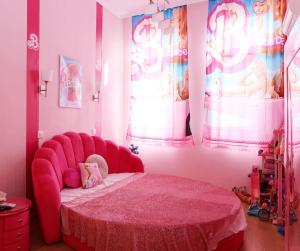 a pink bedroom with a bed with a pink bedspread at Barbie-Themed 3BDR Penthouse Near The Beach, Nessebar in Nesebar