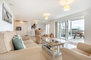 a living room with a couch and a table at 2 Bed in Bournemouth oc-b27914 in Bournemouth