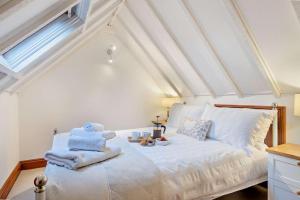 a bedroom with a bed with towels on it at 2 Bed in Bodham oc-m15008 in Bodham