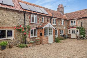 a house with solar panels on the roof at 2 Bed in Bodham oc-t27775 in Bodham