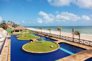 a resort with three golf courses on the beach at Cumbuco Ocean View in Cumbuco