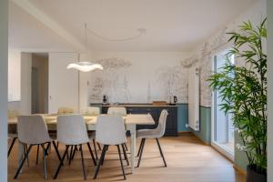 a dining room with a table and chairs at Chambres d'hôtes Les Vergers in Chalais