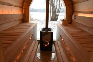 an inside view of a wood stove in a cabin at Ferienhaus-Park Brennickenswerder in Lychen