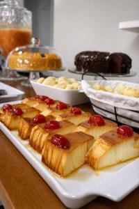 a white plate with cakes and other foods on a table at Miraflores Hotel in Macapá