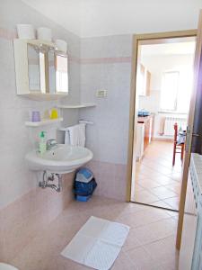 a bathroom with a sink and a mirror at Apartmani ANITA in Umag +67 photos